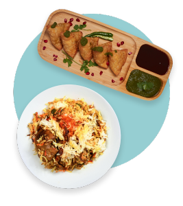 samosas and chicken biryani on plates