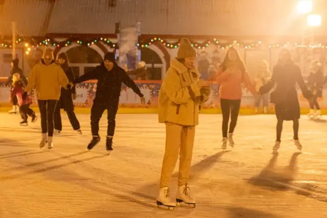 Group of adults ice skating