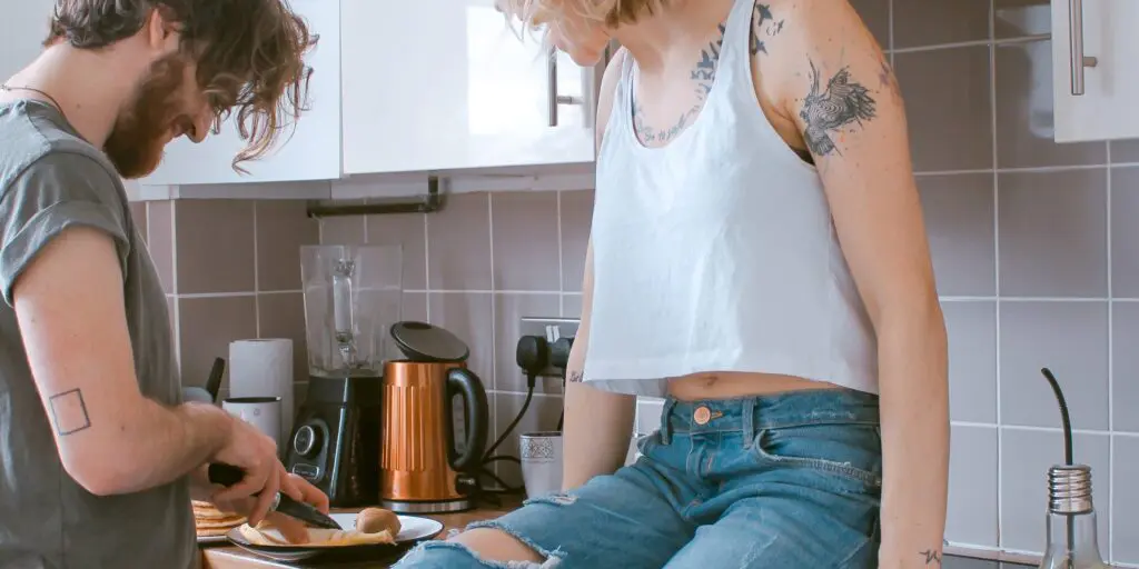 Couple cooking dinner together