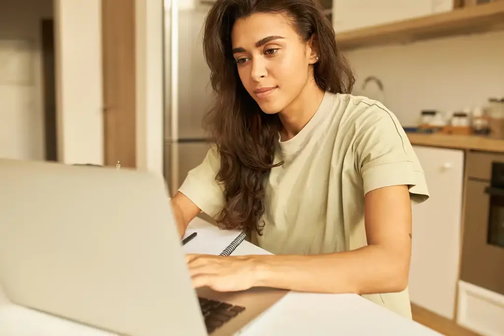 Person looking at their monthly expenses on a computer screen.