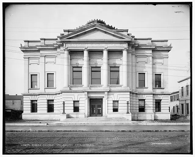 A black-and-white picture of a building with columns